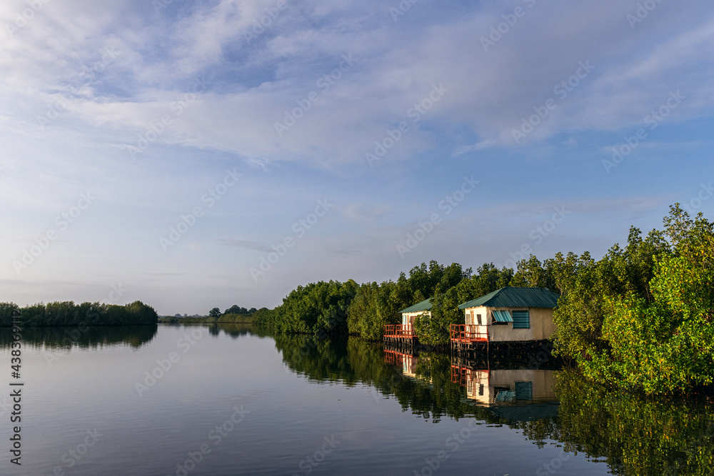Idyllic Rural House Reflecting In Waterfront Idyllic Rural House Reflecting In Waterfront