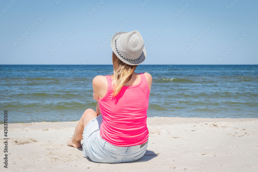 Young girl walking on the beach
