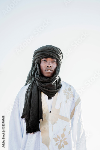 Black man in keffiyeh in desert