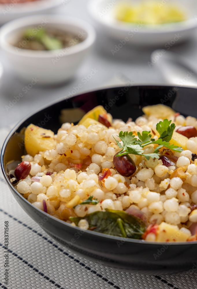 Sabudana khichdi is an Indian dish made from soaked sago or tapioca pearls Sabudana khichdi is an Indian dish made from soaked sago or tapioca pearls