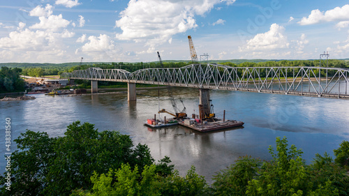 An old bridge over the Missouri River near Washington, MO being repaired.
