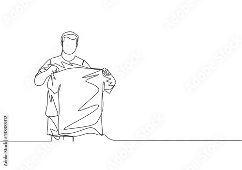 One continuous line drawing of young rising football star holding his new jersey while introduced at press conference. Soccer match sports concept. Single line draw design vector illustration