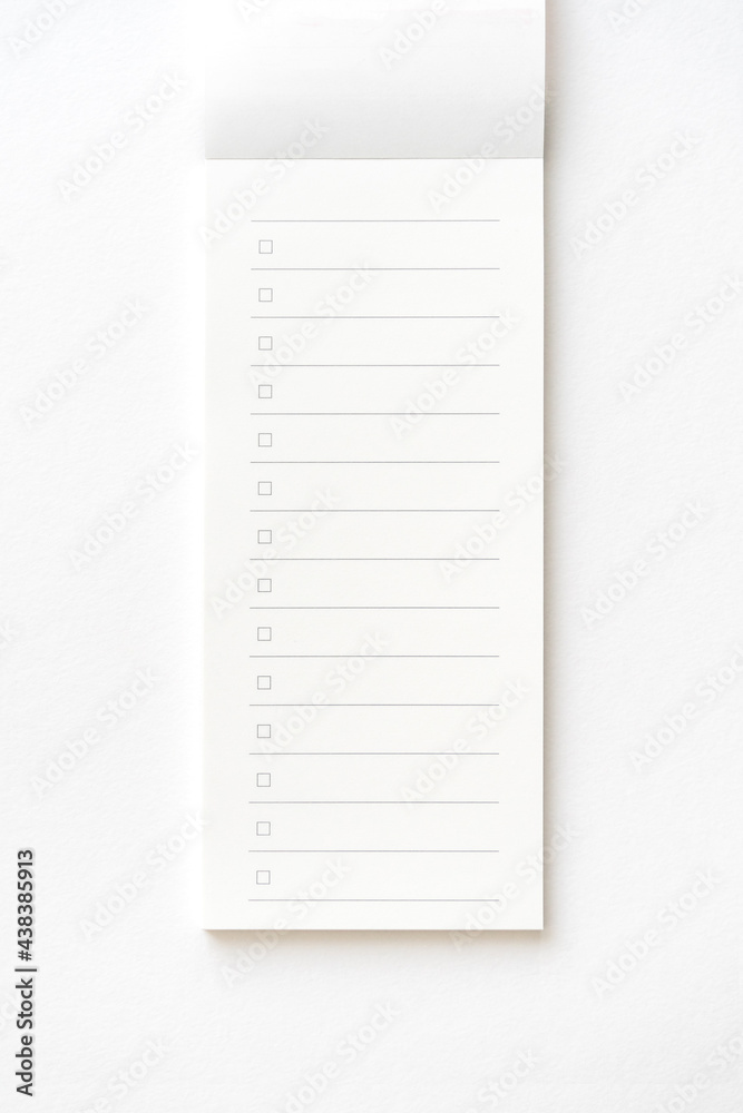 Blank note paper pad isolated on gray with clipping path. Blank note paper pad isolated on gray with clipping path.