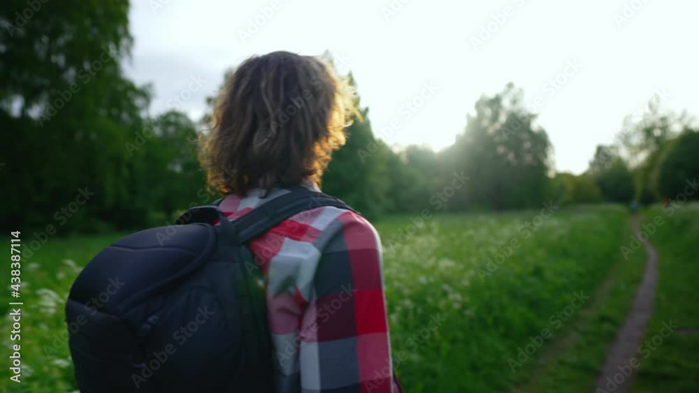 Man with rucksack walking in the forest. Man with rucksack walking in the forest.