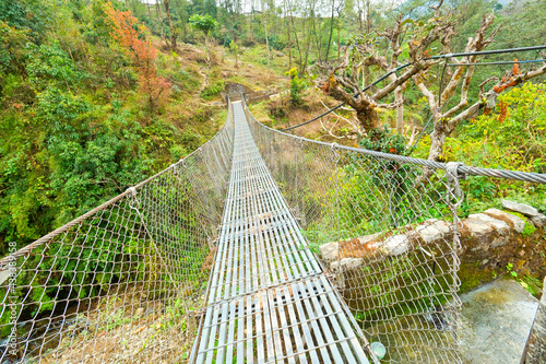 Suspension Footbridge, Trek to Annapurna Base Camp, Annapurna Conservation Area, Himalaya, Nepal, Asia © Al Carrera