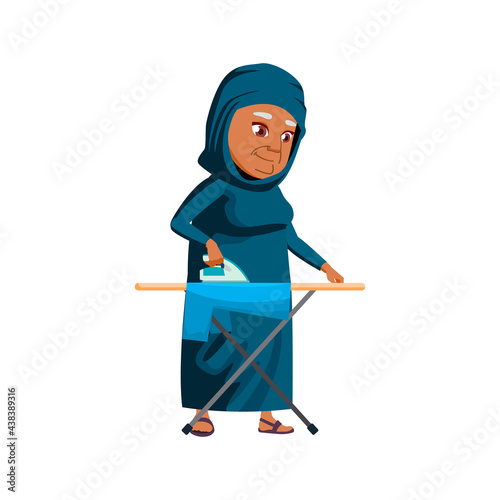 old arab woman ironing clothes cartoon vector. old arab woman ironing clothes character. isolated flat cartoon illustration