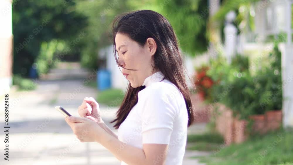 Happy casual woman checking smart phone on line content.Happy woman enjoying spending time in social network. Happy casual woman checking smart phone on line content.Happy woman enjoying spending time in social network.