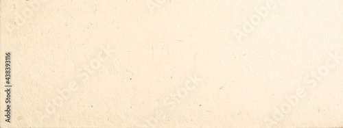 Light natural unpainted old cardboard or kraft paper texture background
