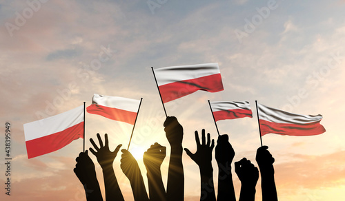 Silhouette of arms raised waving a Poland flag with pride. 3D Rendering