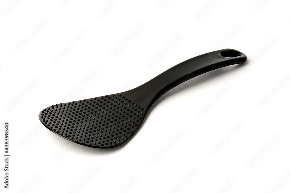black multicooker spoon isolated on white background. plastic heat-resistant spoon stirrer