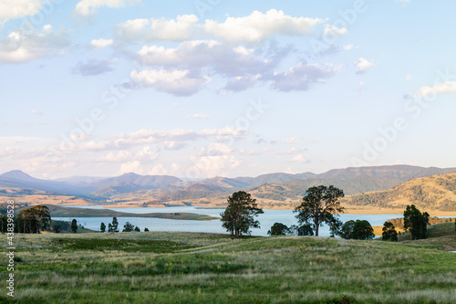 View of paddocks and Lake St Clair in the distance in evening light