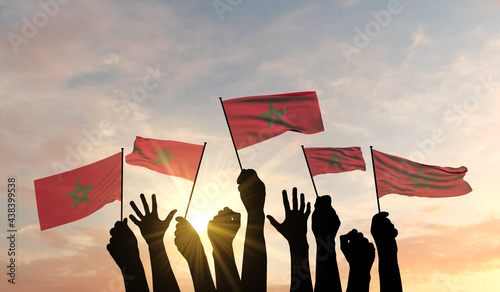 Silhouette of arms raised waving a Morrco flag with pride. 3D Rendering photo