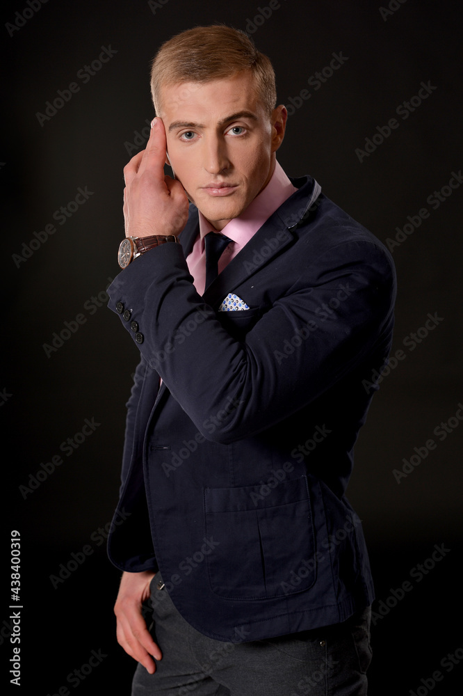 Portrait of young businessman posing  in studio