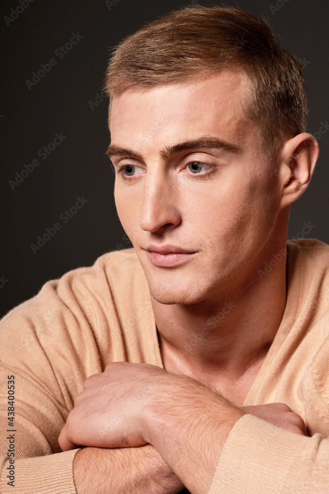 Obraz premium Portrait of thoughtful handsome young man posing in studio