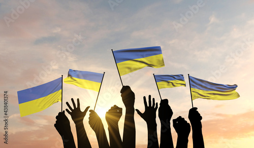 Silhouette of arms raised waving a Ukraine flag with pride. 3D Rendering photo