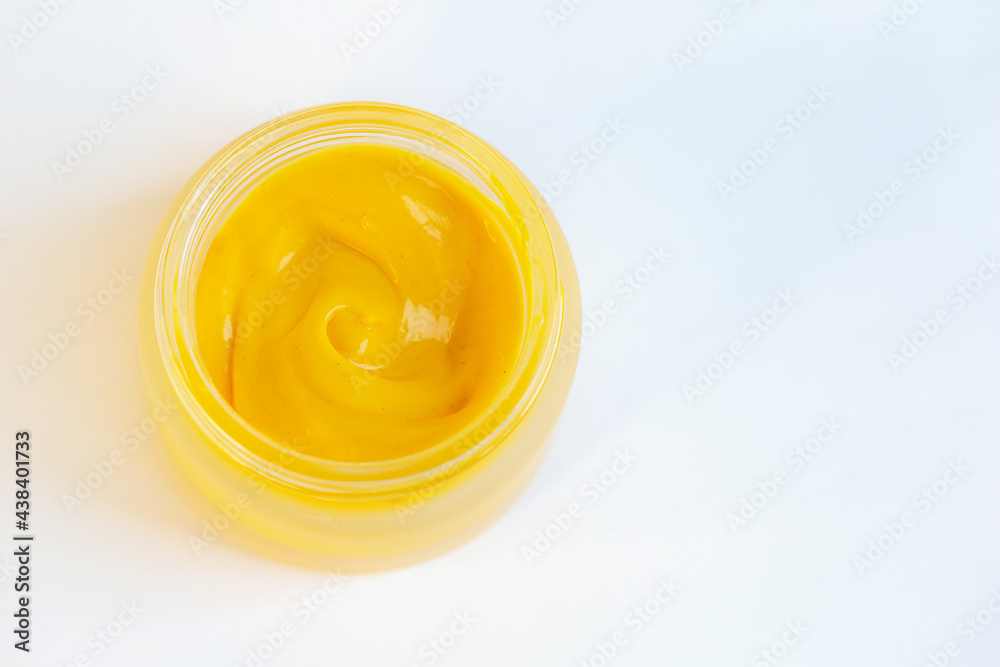 Cream in a jar on a white background Cream in a jar on a white background