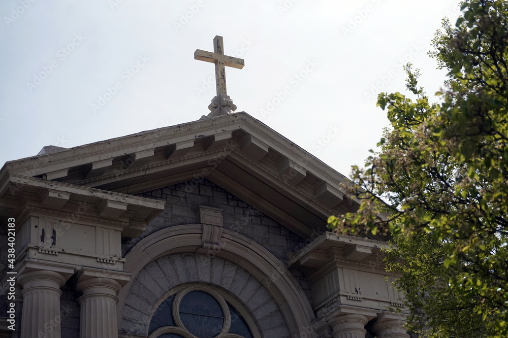 White Cross On Peaked Church Roof in Daylight White Cross On Peaked Church Roof in Daylight