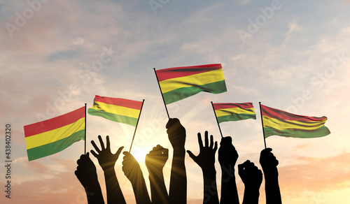 Silhouette of arms raised waving a Bolivia flag with pride. 3D Rendering photo