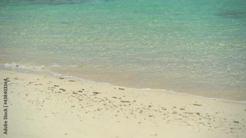 Tropical beach view, Top view of waves break on tropical white sand beach. Sea waves seamless loop on the beautiful sand beach. Carribean sea. Pacific ocean. Paradise place. Calm and pace. Vacation Tropical beach view, Top view of waves break on tropical white sand beach. Sea waves seamless loop on the beautiful sand beach. Carribean sea. Pacific ocean. Paradise place. Calm and pace. Vacation