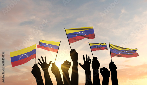 Silhouette of arms raised waving a Venezuela flag with pride. 3D Rendering photo