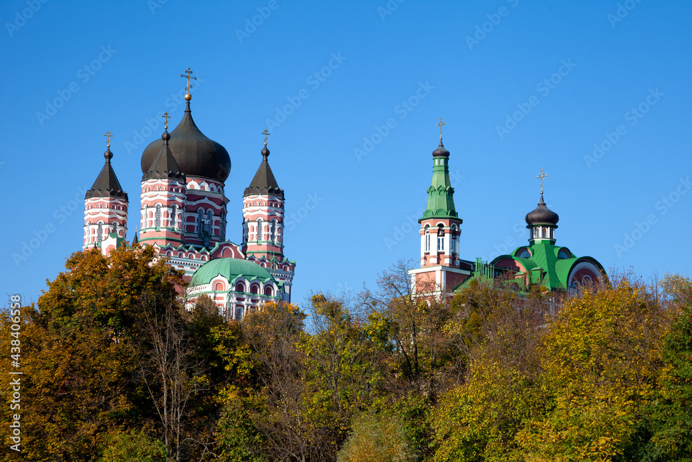 Panteleimon Monastery in Feofania, Kyiv. Beautiful old red orthodox church. Crosses on the domes. Cathedral Area. The Feofaniya Park is one of the most beautiful places in Kiev, Ukraine