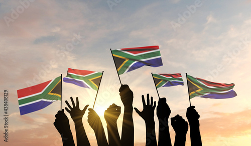 Silhouette of arms raised waving a South Africa flag with pride. 3D Rendering