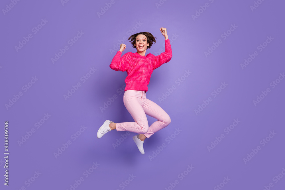 Full length photo of young girl happy excited rejoice win victory success goal fists hands isolated over violet color background