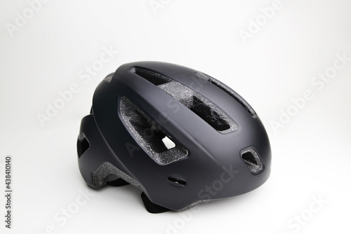 Black helmet on white. This helmet is used to practice cycling. Bike helmet. Black bicycle helmet. Isolated on white, clipping path included. 