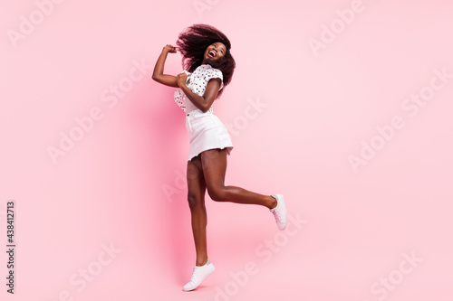 Full size photo of crazy positive dark skin person enjoy weekend disco isolated on pink color background © deagreez