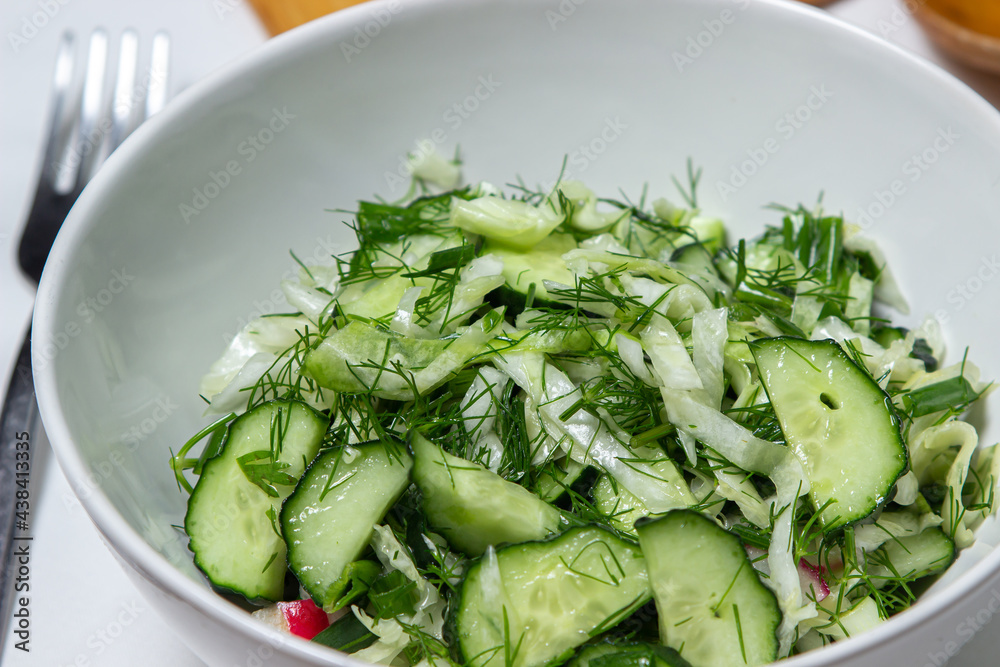 Diet salad of cucumbers and cabbage. Healthy diet. Vegetarian food Diet salad of cucumbers and cabbage. Healthy diet. Vegetarian food
