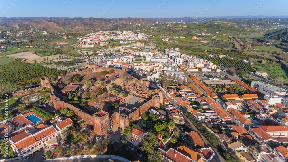 The Portuguese historic village of Silves, Algarve Alentejo zone, view from the sky, aerial. Fortress and in the foreground. Summer