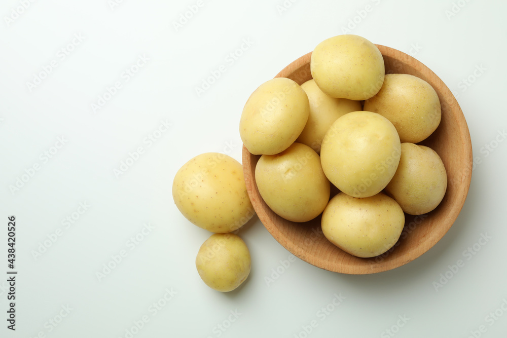 Bowl of young potato on white background