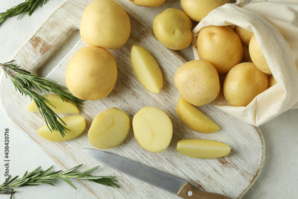 Board with tasty young potato, top view Board with tasty young potato, top view