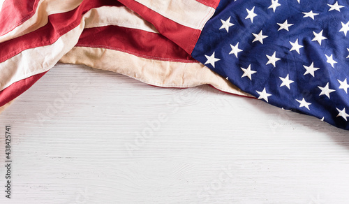 Happy Independence day: 4th of July, American flag on white wooden background.