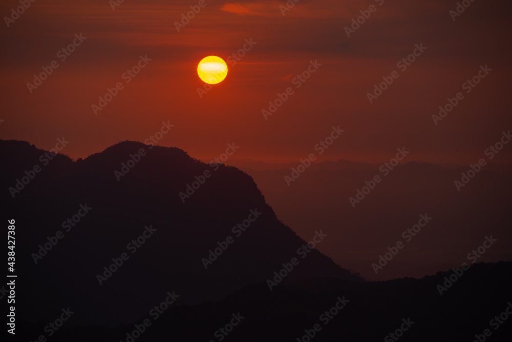 Sunset at the Mountain Hill,Beautiful sunlight, Orange lights background Sunset at the Mountain Hill,Beautiful sunlight, Orange lights background