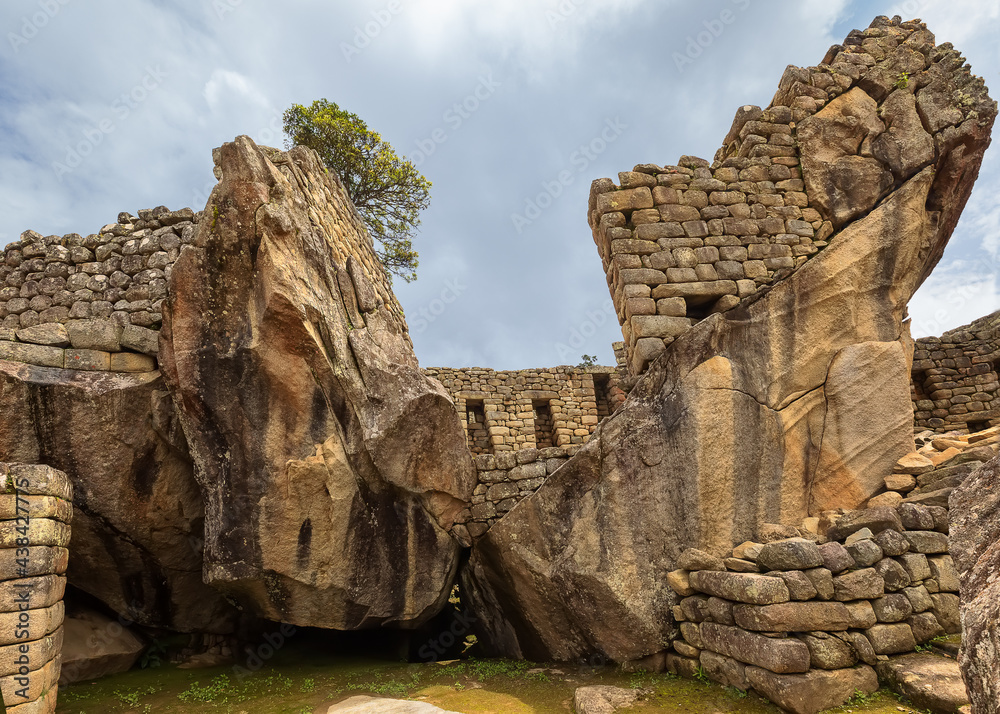 Stone symbols and Ruins of Machu Picchu, the ancient Inca city in the Andes, Cusco, Peru