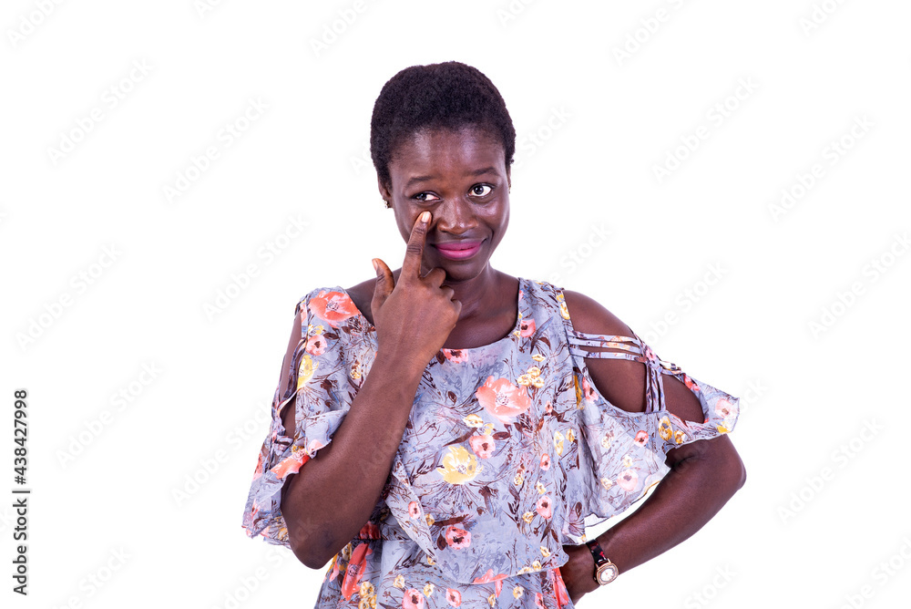 beautiful young woman pointing finger to her eye. beautiful young woman pointing finger to her eye.