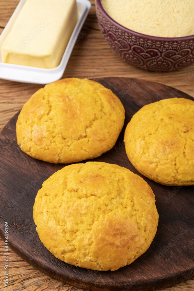 Broa, typical brazilian corn flour bread with ingredients. Butter, herbs and fuba, corn flour