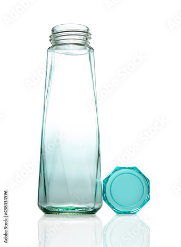 clear green crystal bottle on white background