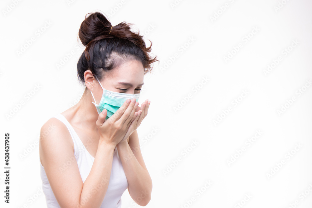 Charming beautiful asian woman wearing mask sneezing and feeling sick, flu, ill concept isolated on white background and copy space. Charming beautiful asian woman wearing mask sneezing and feeling sick, flu, ill concept isolated on white background and copy space.
