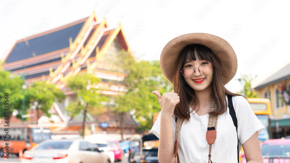 Happy smile young adult asian woman traveller wear eyeglasses travel on day.