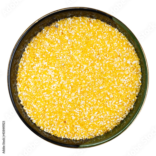 coarse cornmeal in round bowl isolated photo