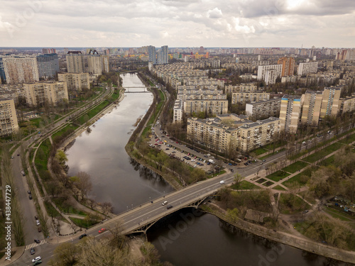 Residential area of Kiev near the river. Aerial drone view. © Sergey
