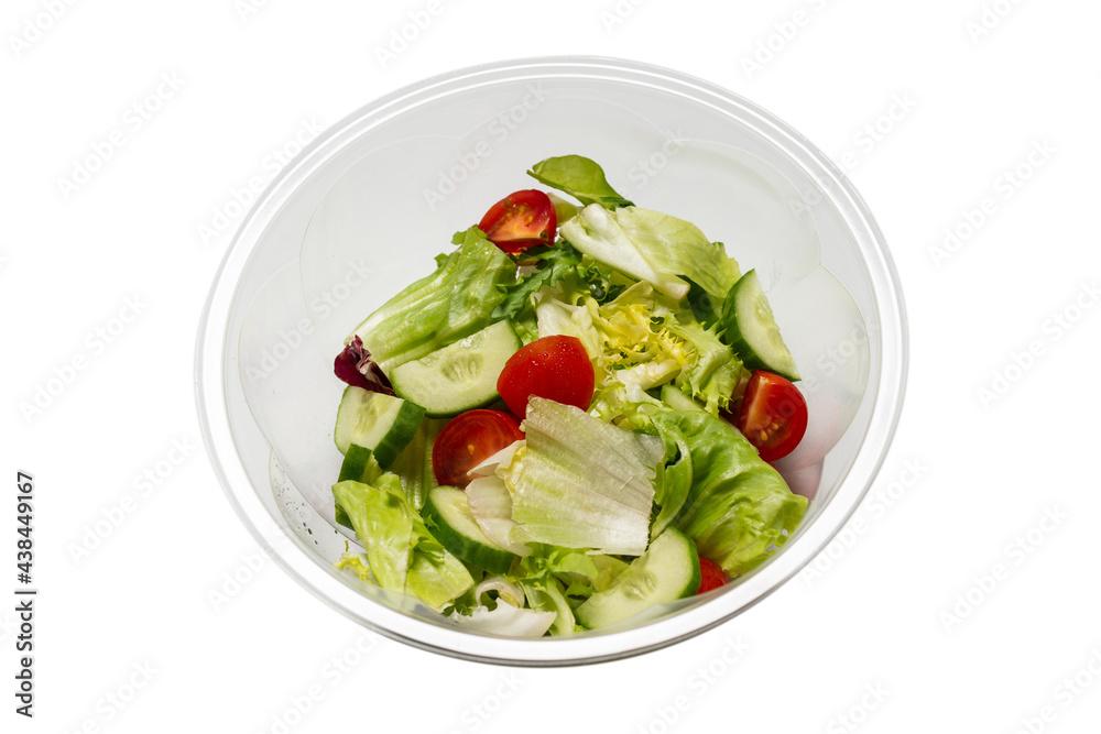 Salad with fresh vegetables isolated on a white background. Salad with fresh vegetables isolated on a white background.