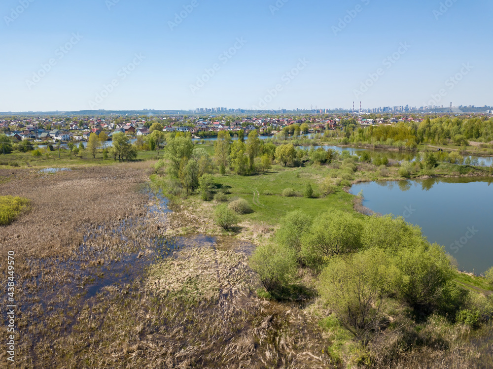 River bank in spring. Aerial drone view.