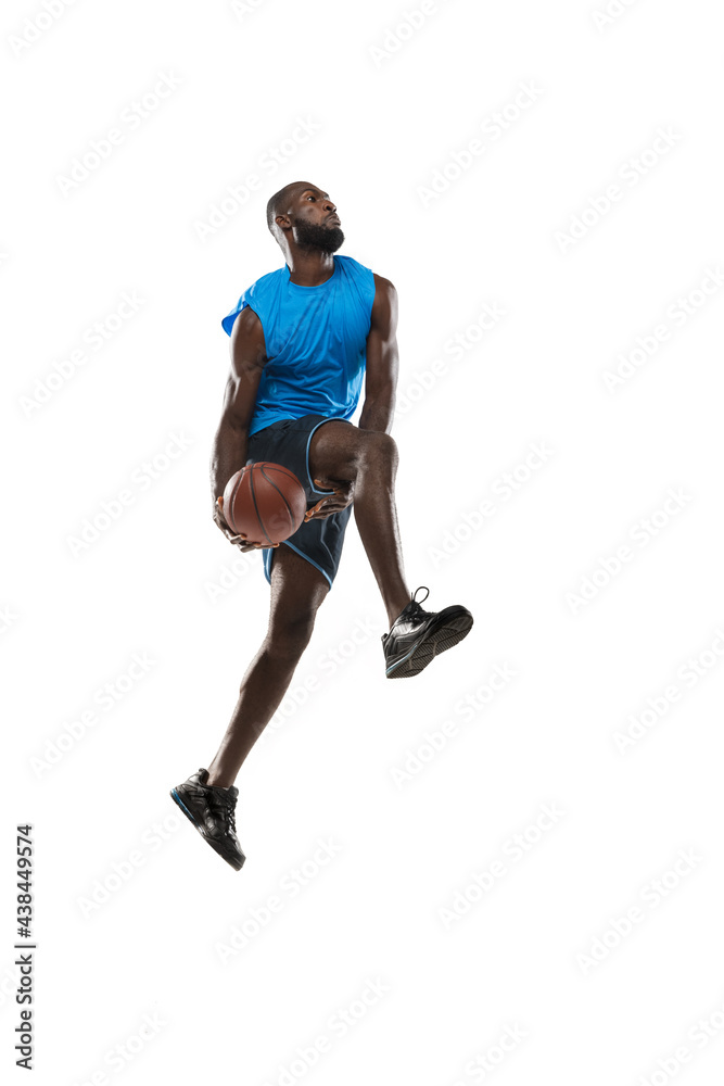 © master1305 - Full length portrait of a basketball player with a ball isolated on white studio background. advertising concept. Fit african american athlete jumping with ball.