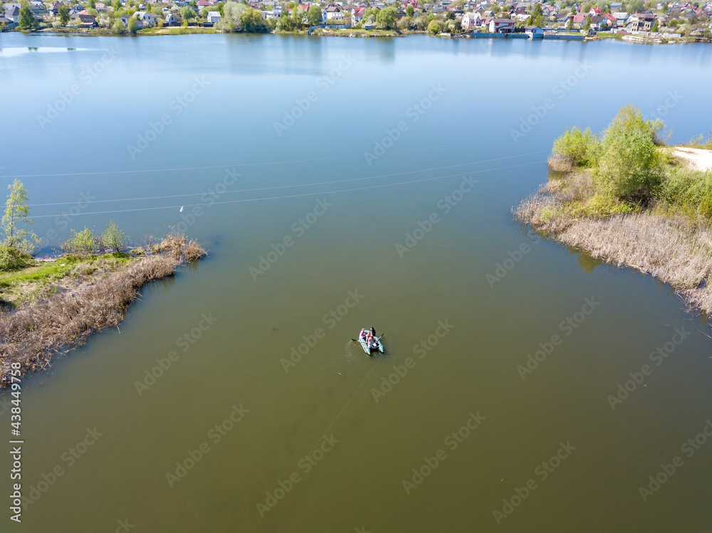 Fishing boat on the river. Aerial drone view. Fishing boat on the river. Aerial drone view.