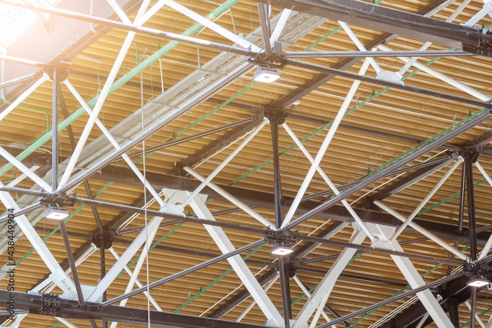 Ceiling at airport - modern architecture. Metal roof frame with lighting and ventilation systems of modern mall building