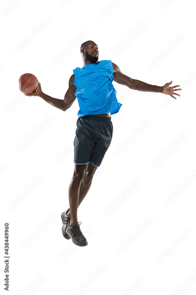 Full length portrait of a basketball player with a ball isolated on white studio background. advertising concept. Fit african american athlete jumping with ball.