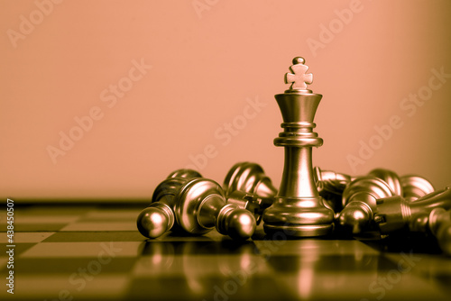 Closeup of chess characters on board games. to represent decision making in term of business strategy to find out the best solution to meet target objective and goal. photo